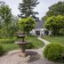 The Connecticut River Valley Inn in Glastonbury garden with fountain, curved path and white house