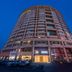 Home Inn Neo Changzhou Wanda Plaza Tongjiang Avenue exterior at dusk in Changzhou with parked cars