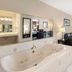 Best Western Inn & Suites - Midway Airport Burbank suite with whirlpool tub, sofa and window seating