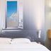 B&B HOTEL Calais Centre St Pierre room with bed and wall mural of sea view in Calais