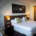 Hosteria de Torazo Nature Hotel & Spa room in Torazo with twin beds and warm wood wardrobe