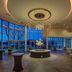 Sheraton Eatontown Hotel lobby with chandelier, floor-to-ceiling windows, and lounge seating in Eatontown