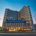 Kingsford Hotel Manila Bay in Manila, modern high-rise hotel exterior at dusk