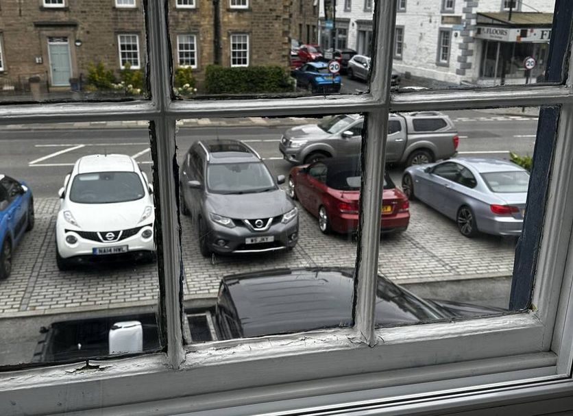 The Cricketers Arms in Barnard Castle window view of parked cars and street outside