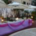 Outdoor event table at Hotel Belvedere in Caserta with pink drapery, flowers, and umbrellas