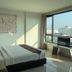 Arawana Regency South Pattaya room with king bed and large city-view window in Pattaya
