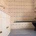 Hostel Himalaya, Kathmandu: tiled bathroom with sink cabinet, toilet, shower fixtures and high window