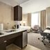 Residence Inn By Marriott New York JFK Airport Queens studio with kitchenette, bed, desk and lounge chair