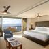 Mana Kai Maui in Kīhei: oceanfront suite with balcony, king bed, sofa, and ocean view