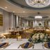 Embassy Suites by Hilton Raleigh Durham Airport Brier Creek ballroom with round banquet tables and floral centerpieces