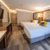 The Westfield Inn, BW Signature Collection guest room with two queen beds and seating area in Westfield