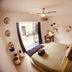 Radio Tulum guest room with queen bed, ceiling fan and open doorway to patio in Tulum