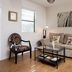 Hotel Flora and Fauna in Wimberley: cozy guest room with sofa, coffee table, accent chair and lamp
