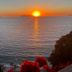 Le Palazzine Hotel in Vlorë with a sunset over the sea and distant islands from the hotel terrace