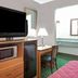 Travelodge by Wyndham Sacramento / Rancho Cordova room with TV, microwave, mini fridge and desk