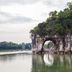 Guilin Golden Dragonball Hotel in Guilin with a scenic river and limestone arch cliff view