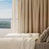 Chris Park Hotel in Campos do Jordão room with bed, curtains, and balcony view