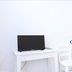 Camere D'Aragona in Otranto room with TV, white desk, chairs, and blue-trimmed door