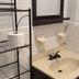 Nwk 457 Room 111-A bathroom sink with mirror, towel bar and shelving in Newark