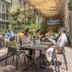 Outdoor patio dining at Lennox Hotel Buenos Aires in Buenos Aires with guests at tables