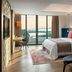 Parklane, a Luxury Collection Resort & Spa, Limassol suite with sea view balcony and modern seating, Pyrgos