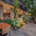 Hotel Somadevi Angkor Boutique and Resort in Siem Reap, outdoor dining area with lush garden seating