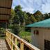 Kinabalu Poring Vacation Lodge in Kundasang with balcony view of lush trees and a green-roofed building