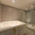 Daegu Dongdaegu H Hotel bathroom with large soaking tub and glass walk-in shower in Daegu