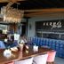 Royal Capital Thermal & Spa Hotel in Bursa restaurant with wooden tables, blue chairs and a chandelier