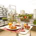 Séjours & Affaires Paris-Vitry terrace table with breakfast overlooking Vitry-sur-Seine street and buildings
