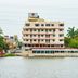 Hotel Graham Villahermosa on the waterfront in Villahermosa, with palm trees and a lake view
