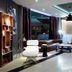Hotel Blue Dream Palace Tripiti Resort lobby with leather sofa, white chair and front desk in Limenaria
