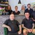 Auto-Parkhotel Hamburg St Pauli lobby staff group standing behind patterned reception desk
