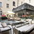 Leonardo Boutique Hotel Krakow Old Town courtyard terrace with seating and planters in Krakow