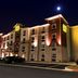 My Place Hotel - Amarillo, TX exterior at night with illuminated facade and parked cars