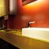 Dormero Hotel Schwäbisch Hall bathroom with double sinks, mirrors and warm lighting