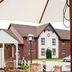 Outdoor seating area at Premier Inn Glasgow - Cambuslang/M74 J2a with hotel building in Glasgow
