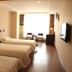 Chengdu Tianfu Lidu Hotel room in Chengdu with three single beds and a bright window