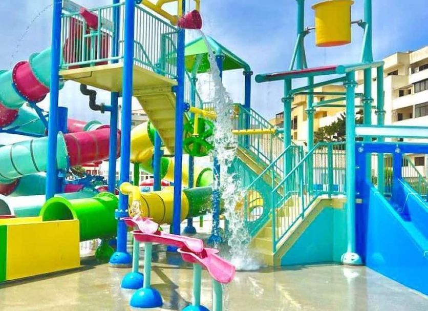 Hotel Cristal Praia Resort & Spa in Vieira de Leiria, colorful outdoor water park with slides and splash features