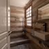 Che Juan Hostel Ba in Buenos Aires bathroom with walk-in shower, vessel sink and wood-paneled walls