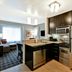 TownePlace Suites by Marriott Dallas Lewisville kitchen and living area with stainless steel appliances