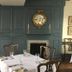 Spread Eagle Tavern and Inn in Hanoverton dining room with dark paneled walls, fireplaces, and set tables