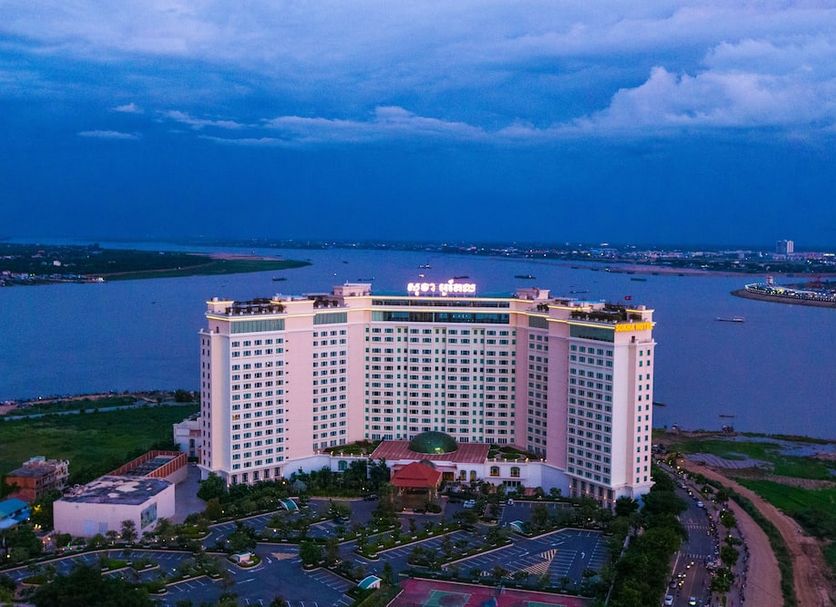 Sokha Phnom Penh Hotel in Phnom Penh with a waterfront cityscape and river views at dusk