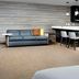 Residence Inn by Marriott Lubbock Southwest living area with sofa, TV, kitchenette bar and seating