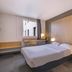 B&B HOTEL La Rochelle Centre guest room with double bed, desk, and window in La Rochelle