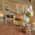 Ashland Hills Hotel & Suites lobby in Ashland with wood floors, seating, and high ceilings