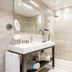 Hotel Laurin in Salò: modern bathroom with walk-in shower, vanity, and towels