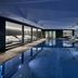 Grace La Margna St Moritz indoor pool with lounge seating in St. Moritz