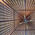 O Villas Seminyak in Kuta, a ceiling fan under a woven roof structure