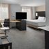Residence Inn by Marriott Fort Worth Cultural District guest suite with sofa, desk, TV and king bed